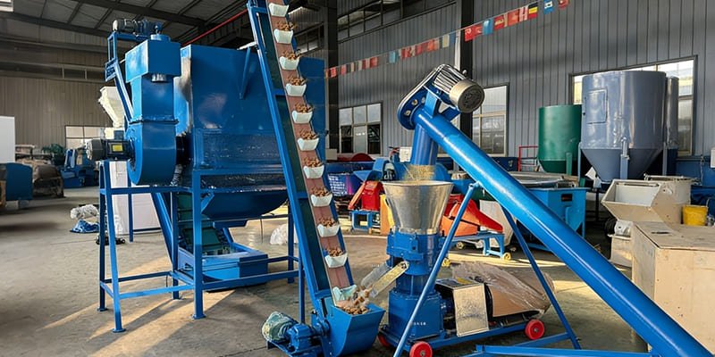 The STROSEN 260 pellet machine extruding finished pellets into a collection bin.