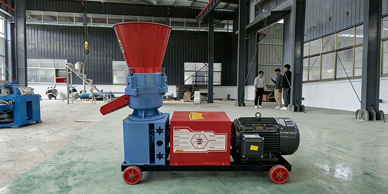 Small Flat Die Pellet Mill for Farm Use a compact flat die pellet mill sitting on a workshop floor