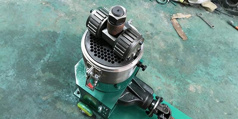 Common Pellet Machine Problems Close-up of a flat die pellet machine showing rollers and die