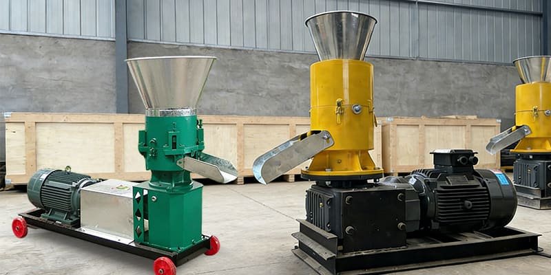 a side-by-side view of a feed pellet machine and a biomass pellet machine in a factory showroom