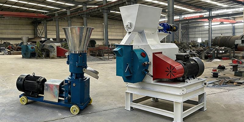 A side-by-side comparison of a small flat die mill and a large industrial ring die mill