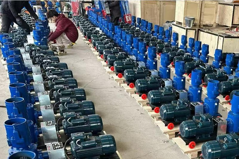 A farmer connecting their own diesel engine to a powerless feed pellet machine, illustrating cost savings.